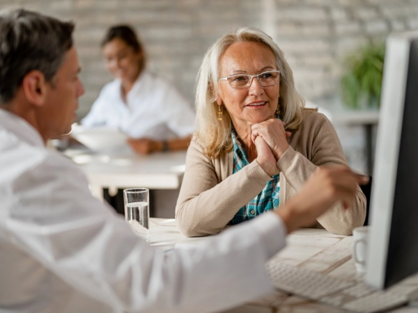 An older woman talks to her doctor about medical options.
